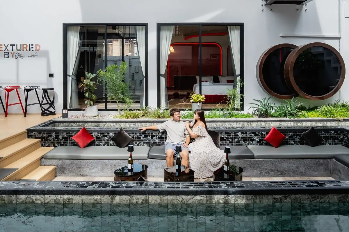 Guests in the courtyard by the water