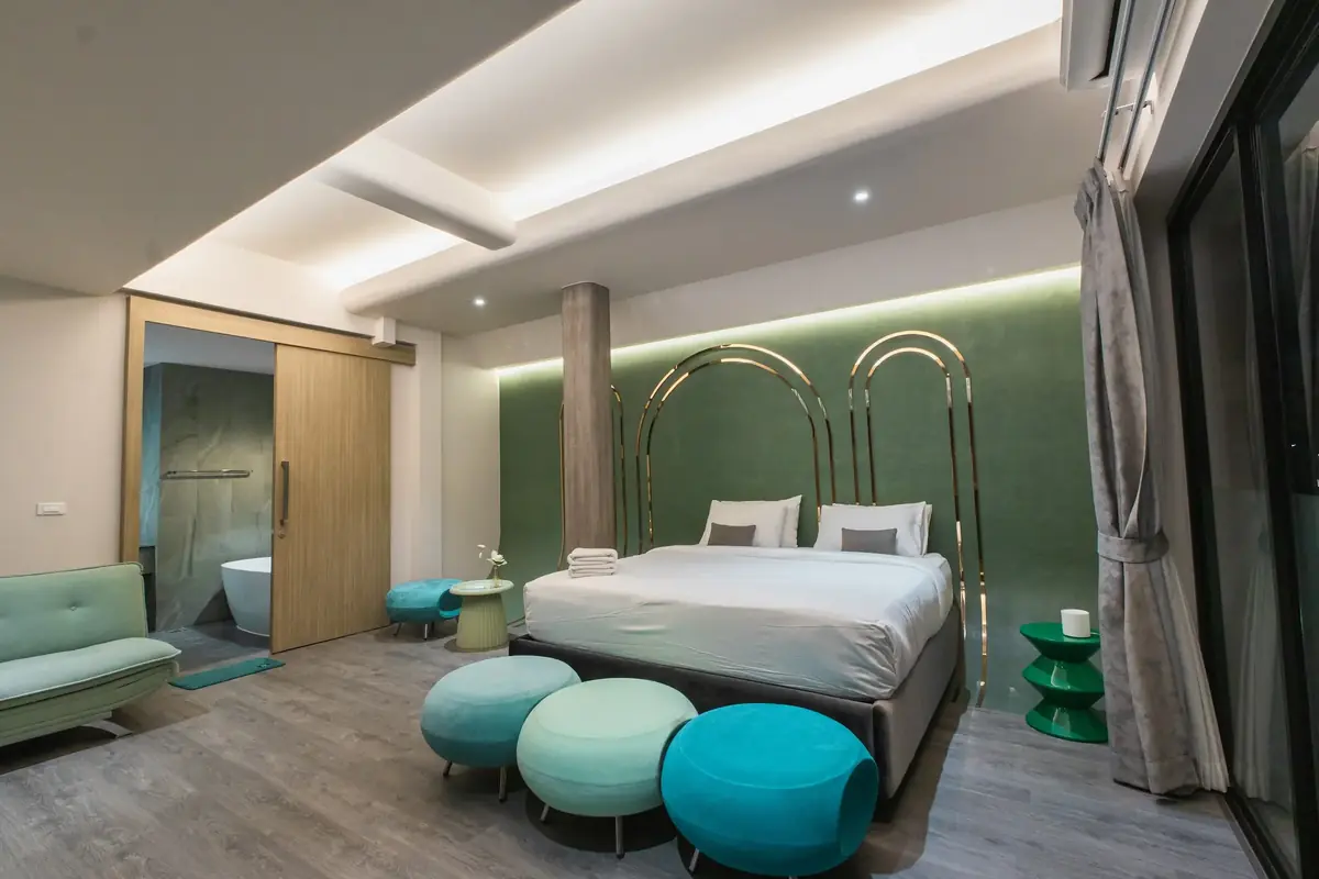Mint Julep suite with green walls and brass arches