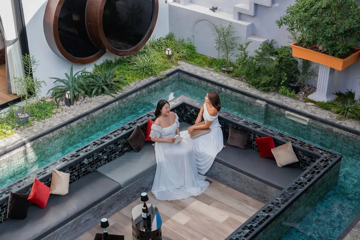 Sunken courtyard lounge surrounded by water